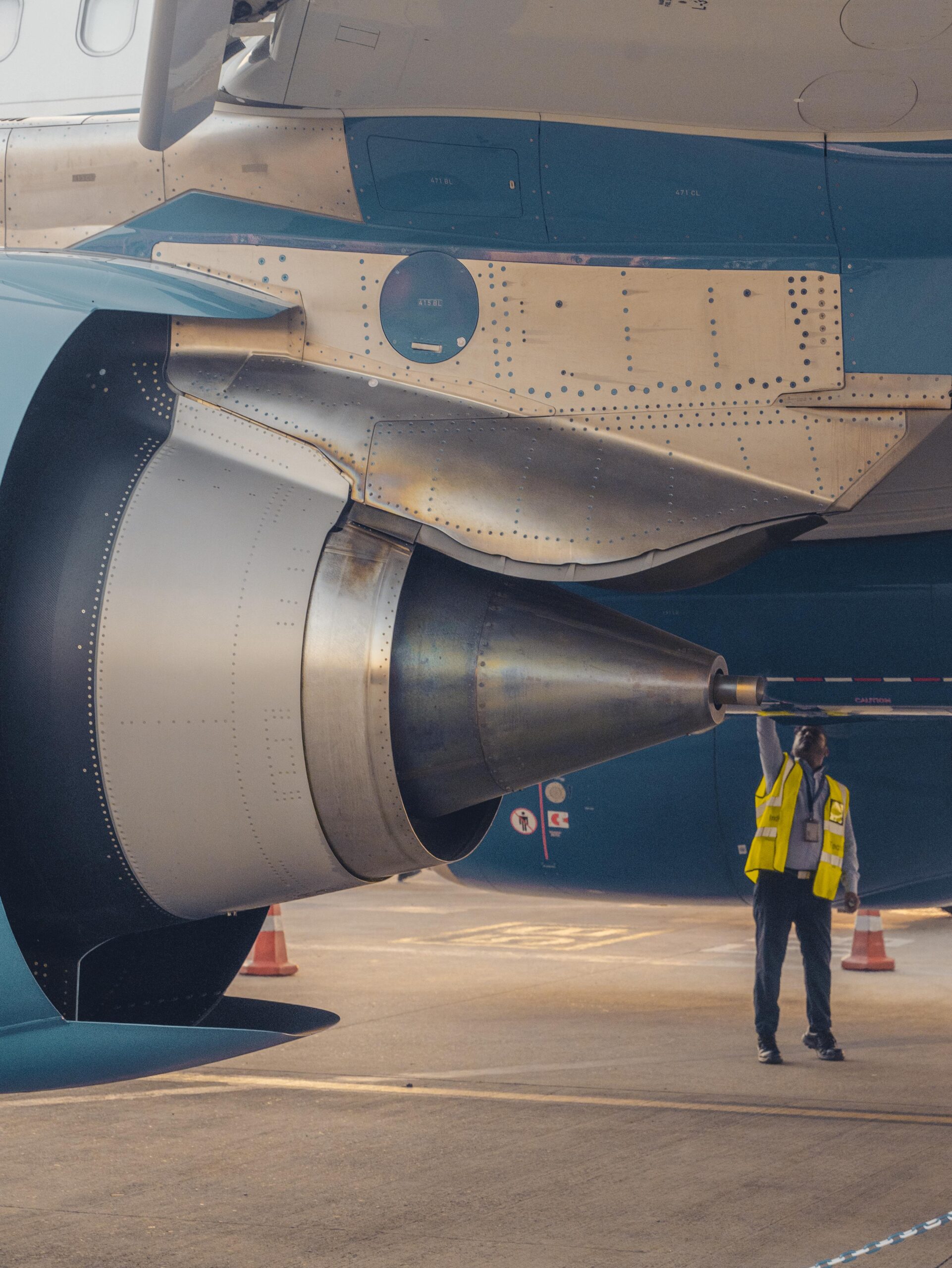 AS9100 - Man inspecting jet engine
